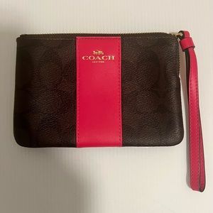 Coach corner zip wristlet wallet.